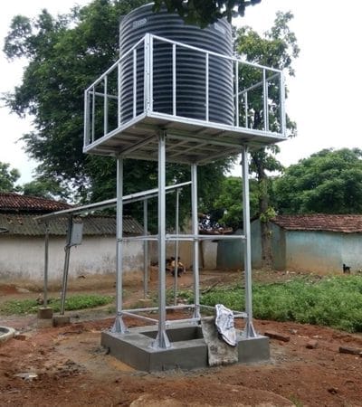 Fabricated galvanized steel elevated water tank stand supporting an overhead storage tank