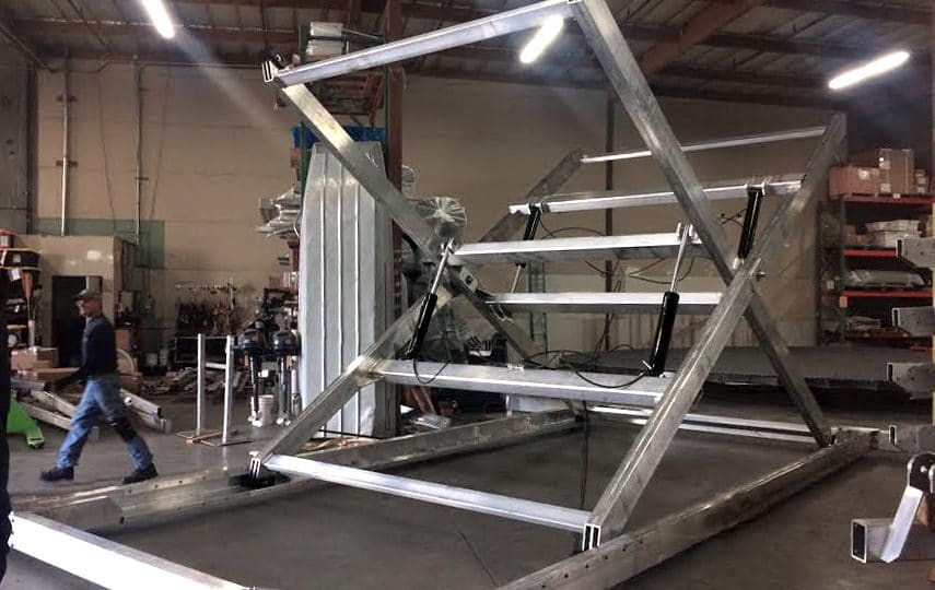 Galvanized steel solar panel mounting structure under fabrication at the SKI workshop