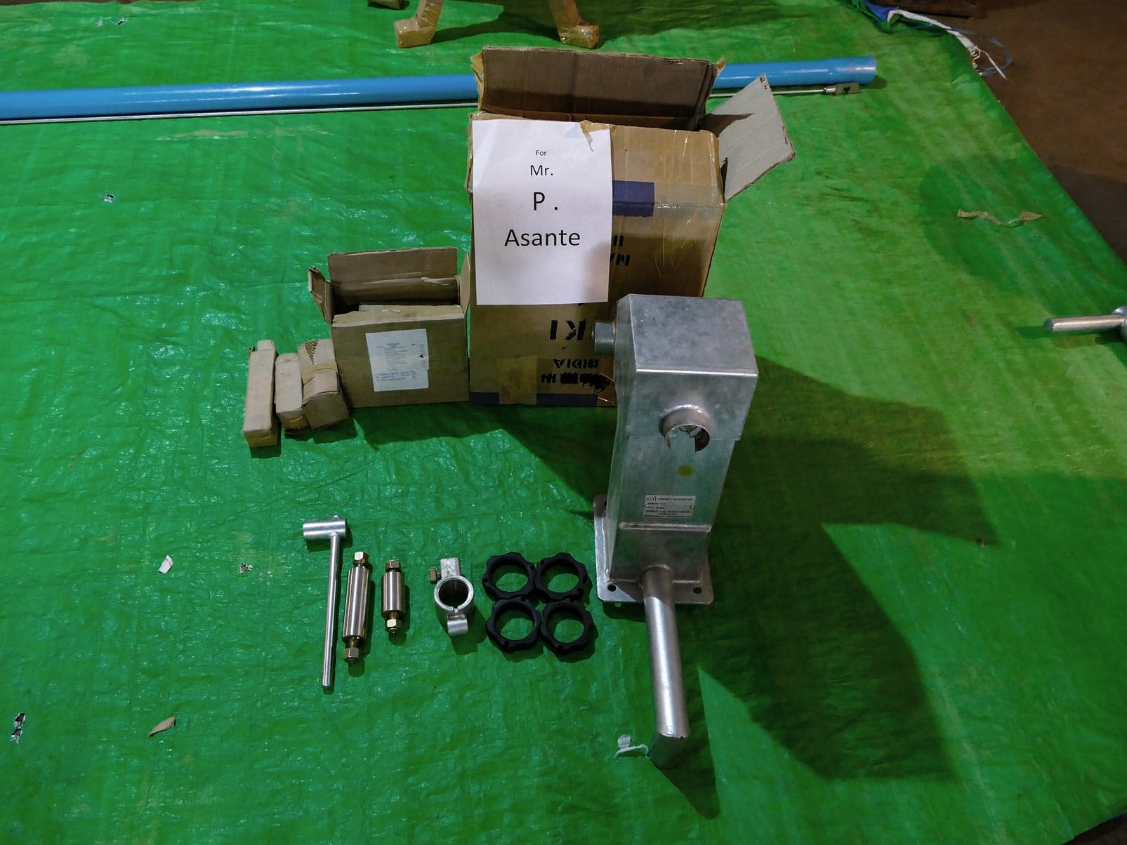 P1070010 Individual India Mark 2 hand pump parts, bolts and cylinder components sorted and labeled for a customer order