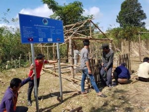IMG-20180714-WA0013 Workers building a bamboo housing structure for an SKI Afridev hand pump at a community well site in Laos