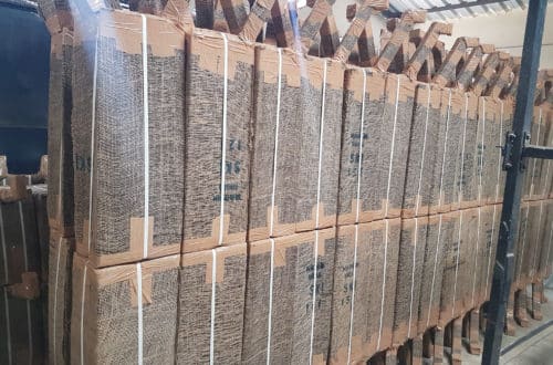 20170419_131000 Rows of hessian-wrapped hand pump cylinders stacked on racks at the SKI packing facility