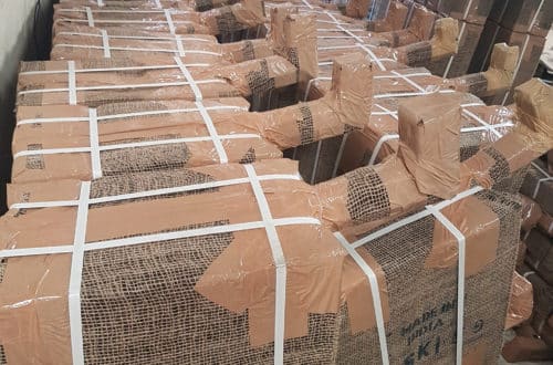 20170419_130918 Hessian-wrapped SKI hand pump bundles stamped "Made in India", lined up for export